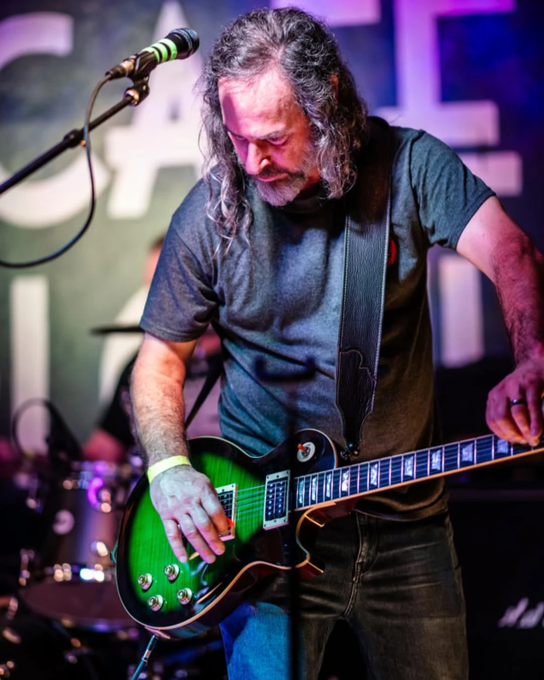 Playing slide on a green Les Paul